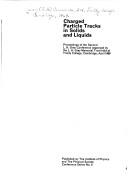 Charged particle tracks in solids and liquids
